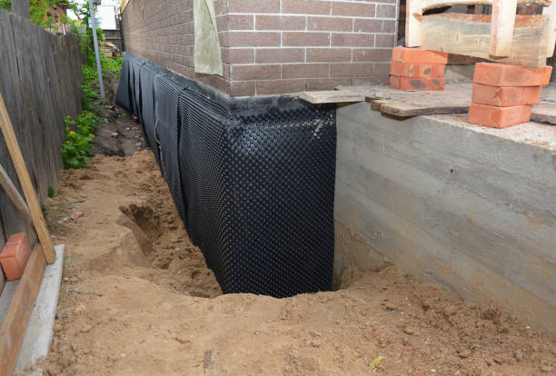 Happy homeowners after waterproofing job in Otterbein
